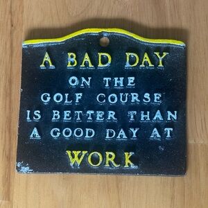 Black and Yellow Golf Course Sign